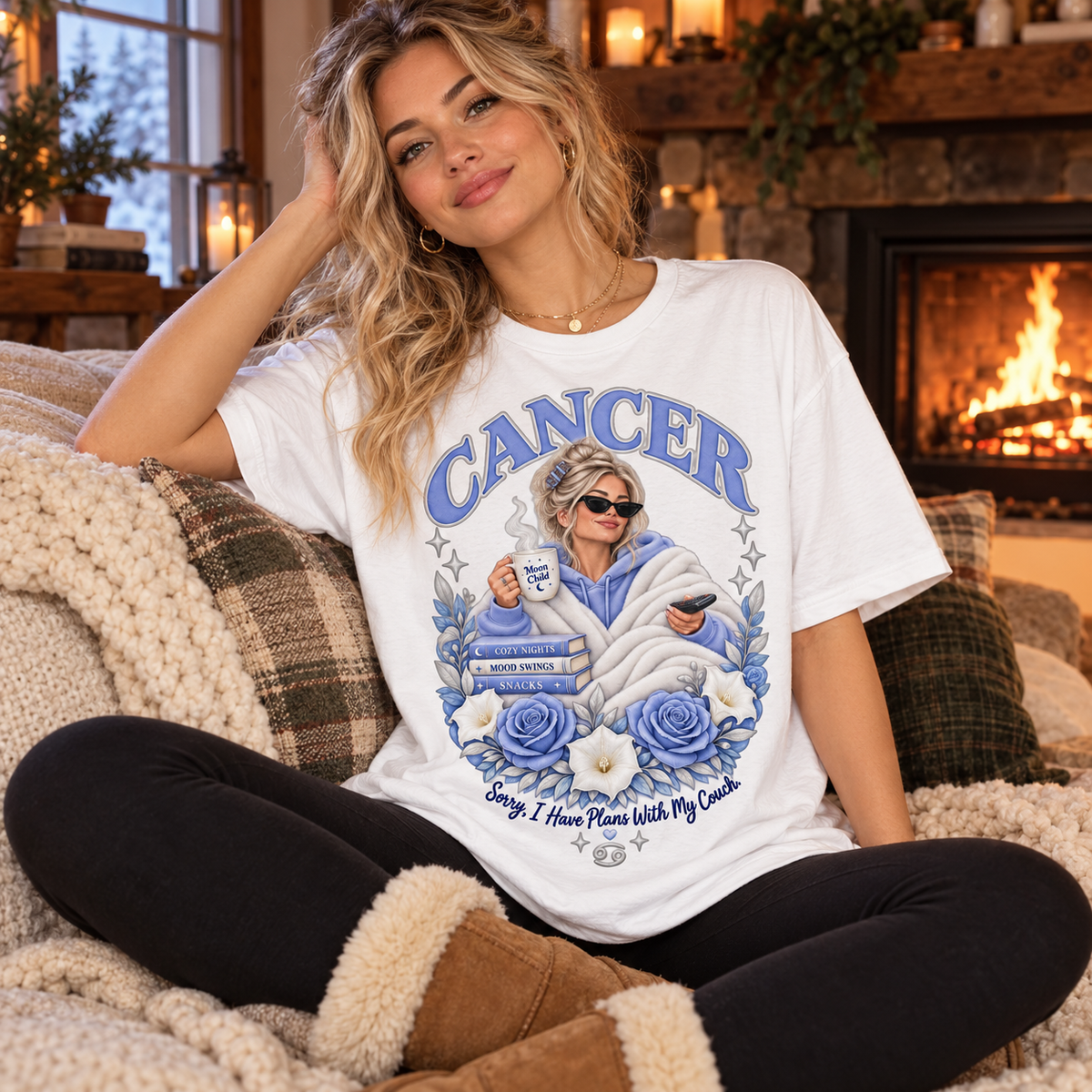 Cancer Plans with My Couch Women's T-Shirt – Light in White, model seated cosily on a sofa beside a fireplace in a warm cottage