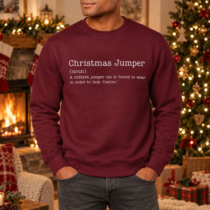 Man wearing Burgundy funny Christmas Jumper definition sweatshirt by a fireplace