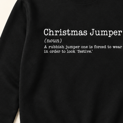 Close-up of white Christmas Jumper dictionary definition print on black sweatshirt