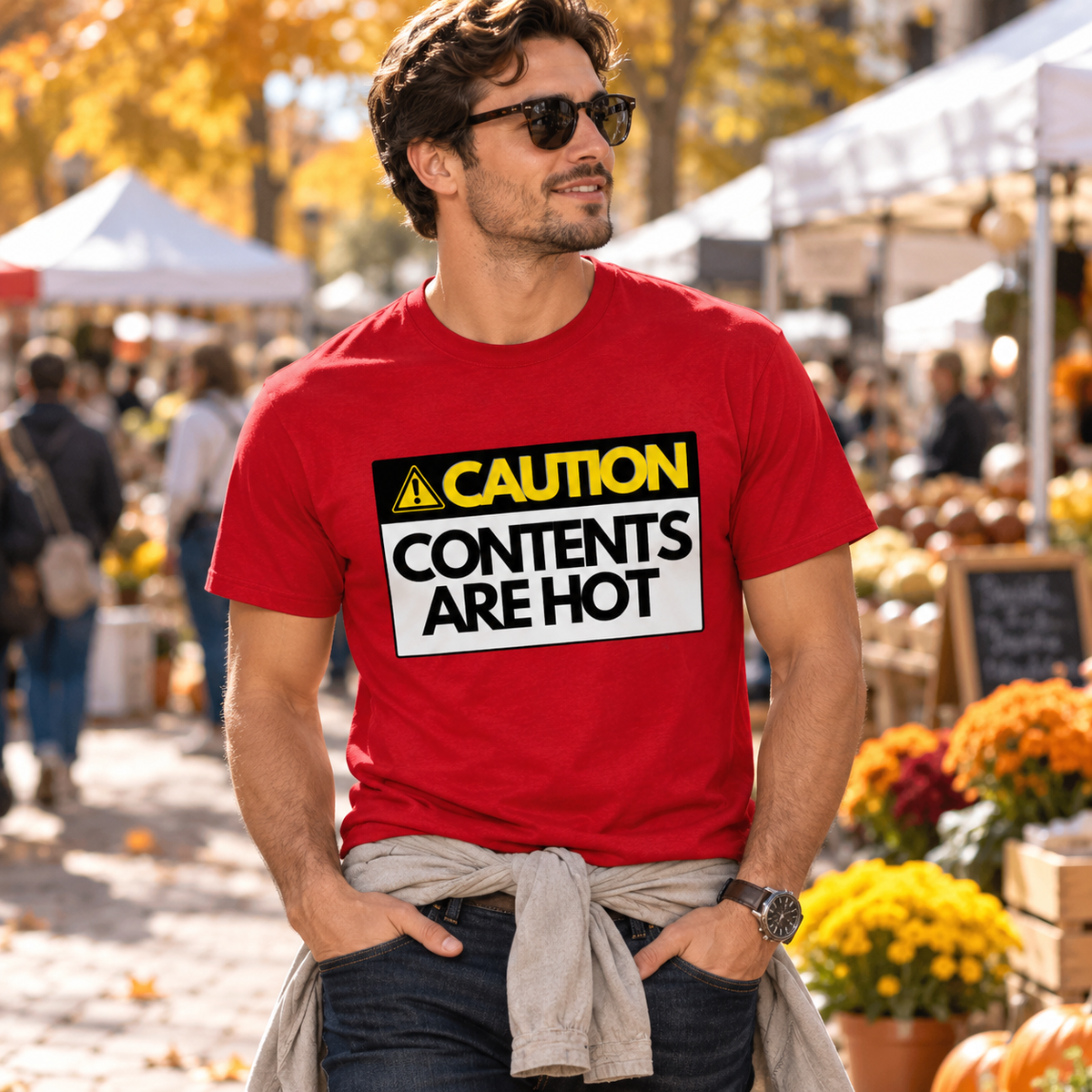 Man wearing red Hot Contents T-shirt at an autumn market