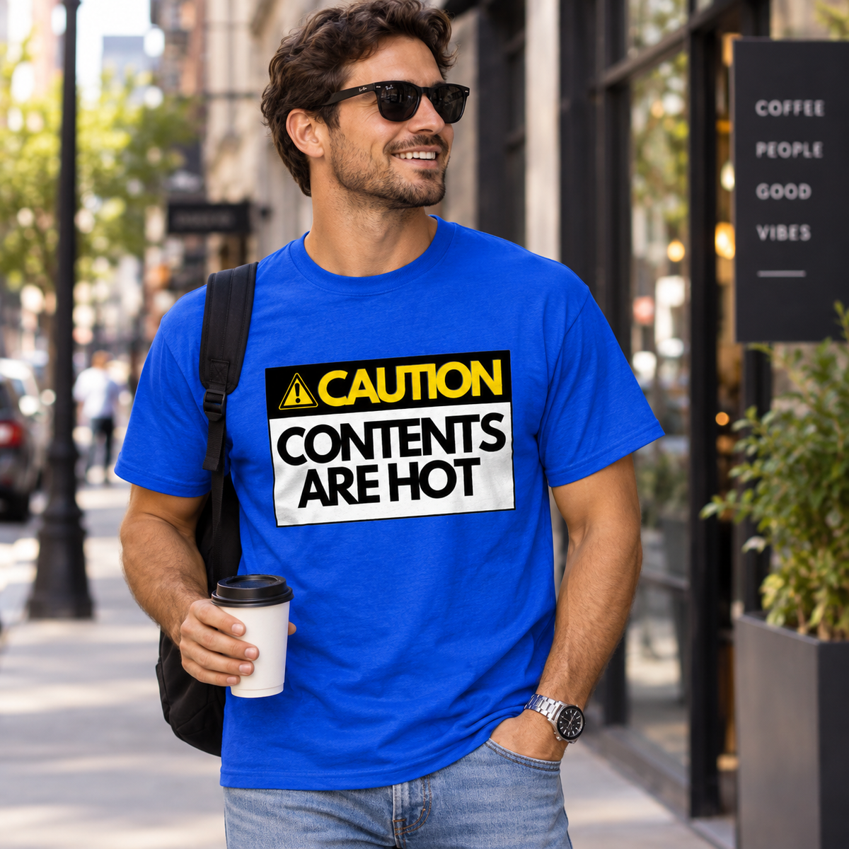 Man wearing Royal Blue Hot Contents men's T-shirt with caution graphic