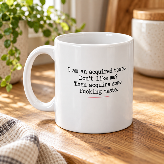 I Am an Acquired Taste Funny Mug in a styled lifestyle setting