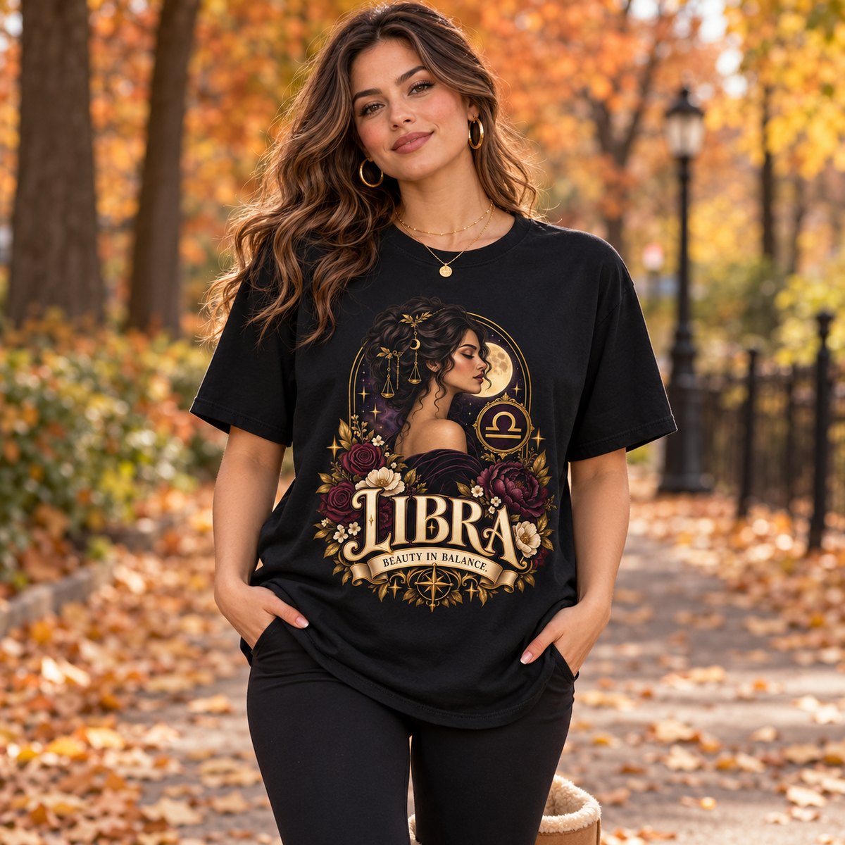 Libra Beauty in Balance Women's T-Shirt – Burgundy in Black, worn by a woman in a lifestyle setting