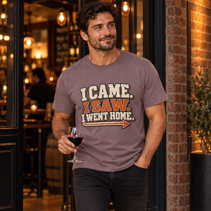 Man wearing the Paragon I Came I Saw I Went Home T-shirt outside a softly lit wine bar