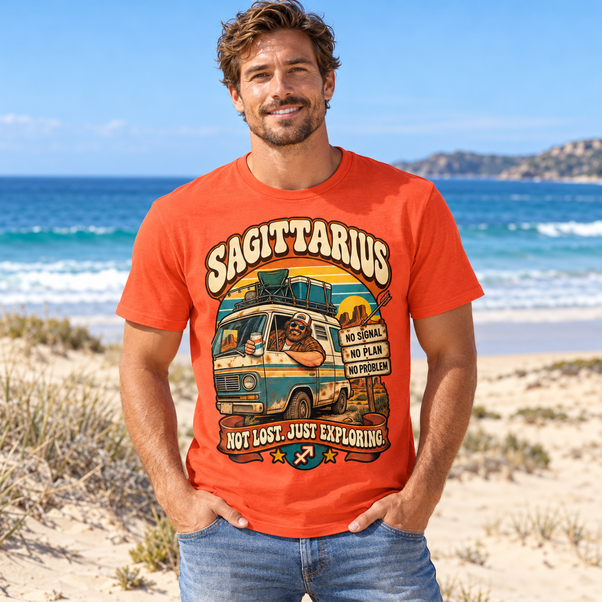 Sagittarius Not Lost Just Exploring Men's T-Shirt in Orange, model on a sandy beach with blue sea and dunes