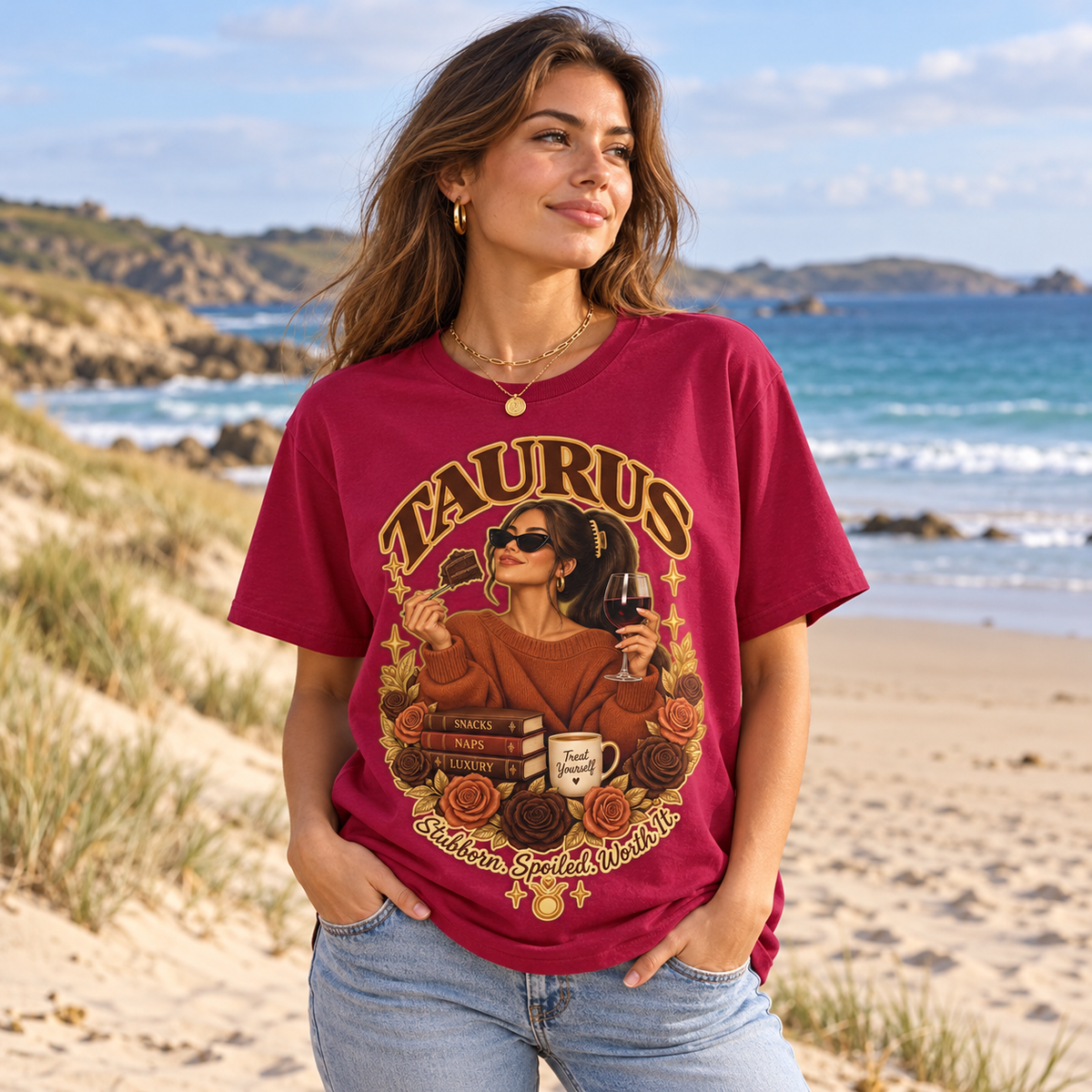 Taurus Stubborn Spoiled Worth It Women's T-Shirt – Dark in Antique Cherry, model walking on a sandy Channel Islands beach with dunes and sea