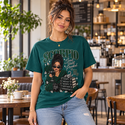 Scorpio Sweet Until Provoked Women's T-Shirt – Dark in Fan Marine Green, model indoors in a stylish cafe