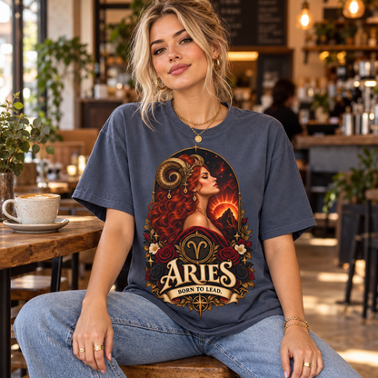 Aries Born to Lead Women's T-Shirt – Dark Colours, model wearing the original design in a cosy stylish coffee shop indoors.