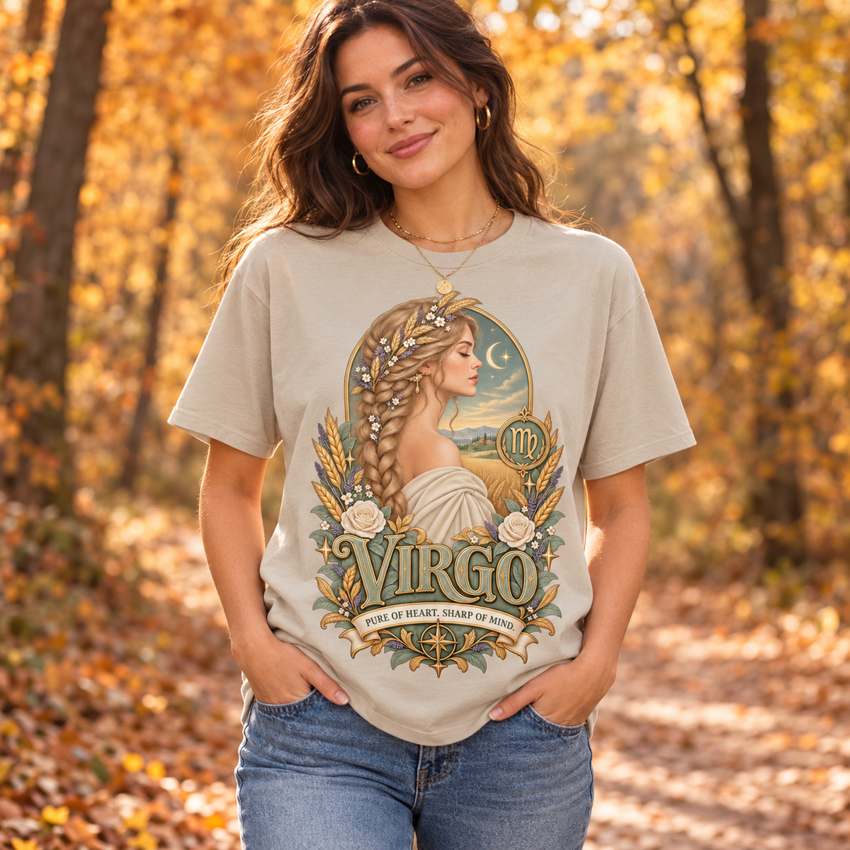 Virgo Pure of Heart Women's T-Shirt – Light in Sand, model on an autumn woodland path with golden foliage