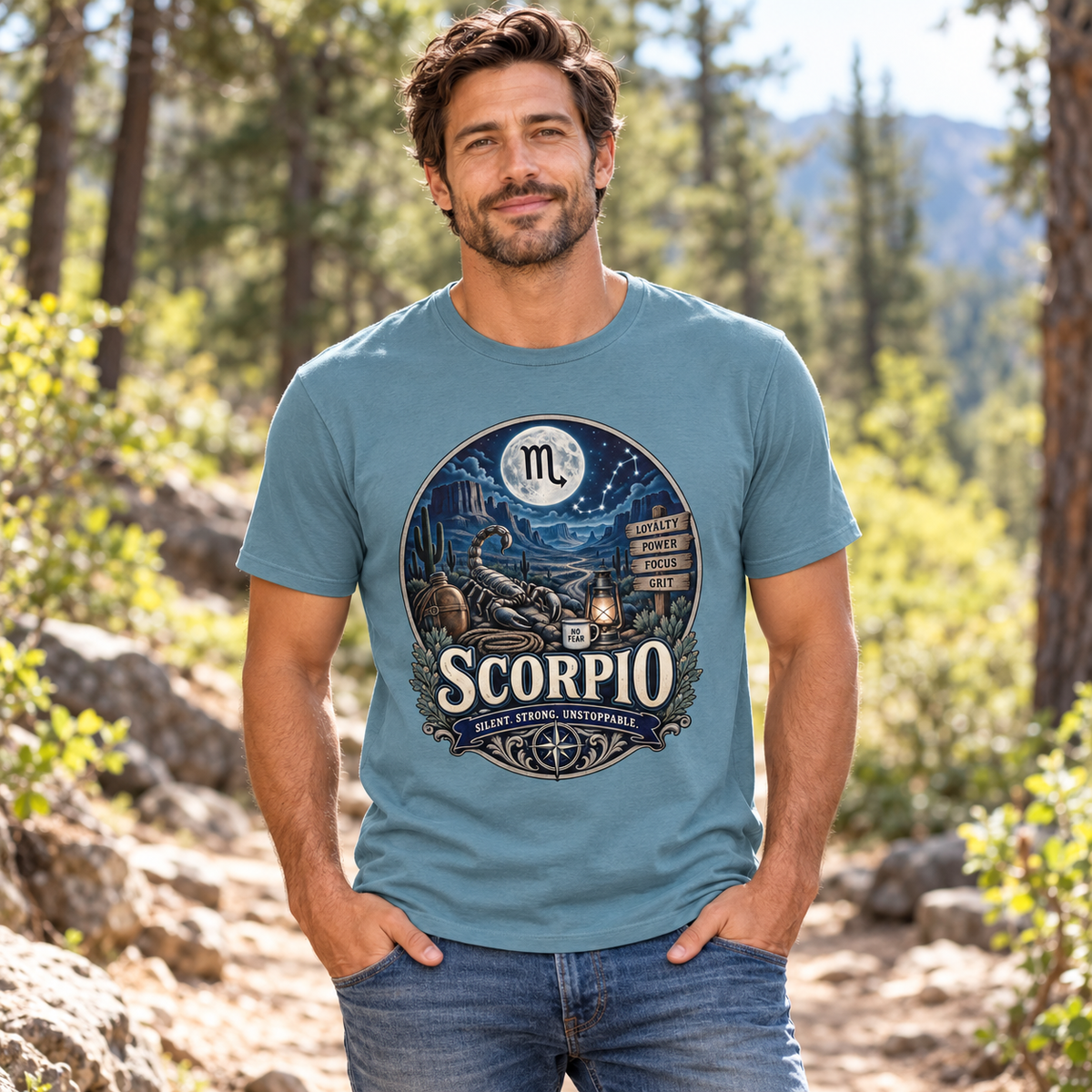 Scorpio Silent Strong Unstoppable Men's T-Shirt in Stone Blue, model outdoors on a woodland trail