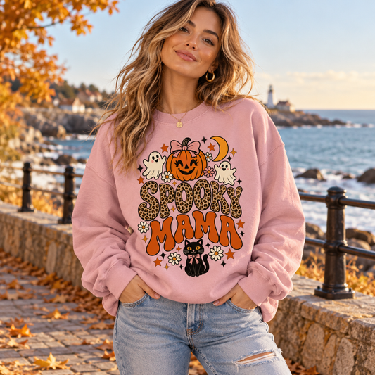 Spooky Mama Women's Halloween Sweatshirt, lifestyle model in a seaside autumn promenade.