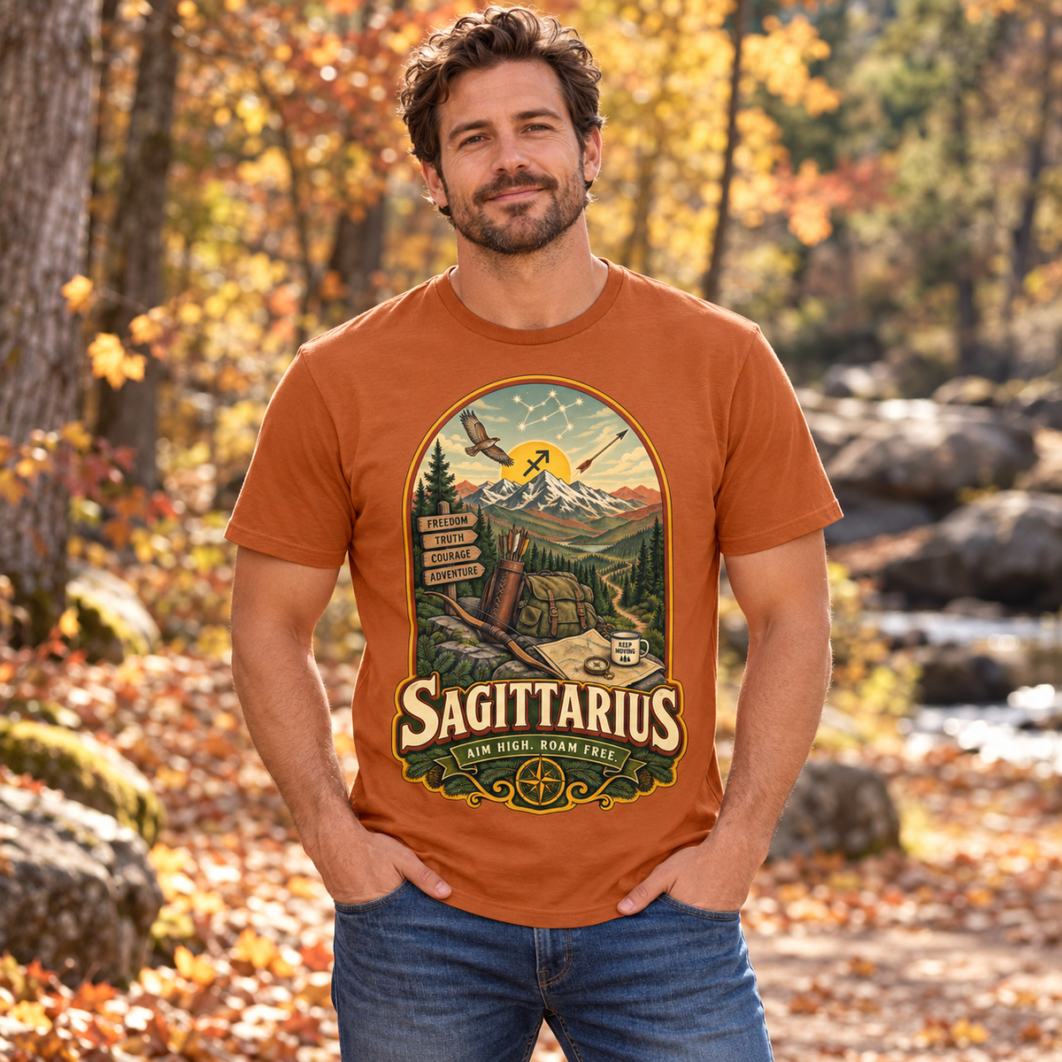 Sagittarius Aim High Roam Free Men's T-Shirt in Fan Texas Orange, model outdoors in an autumn woodland park
