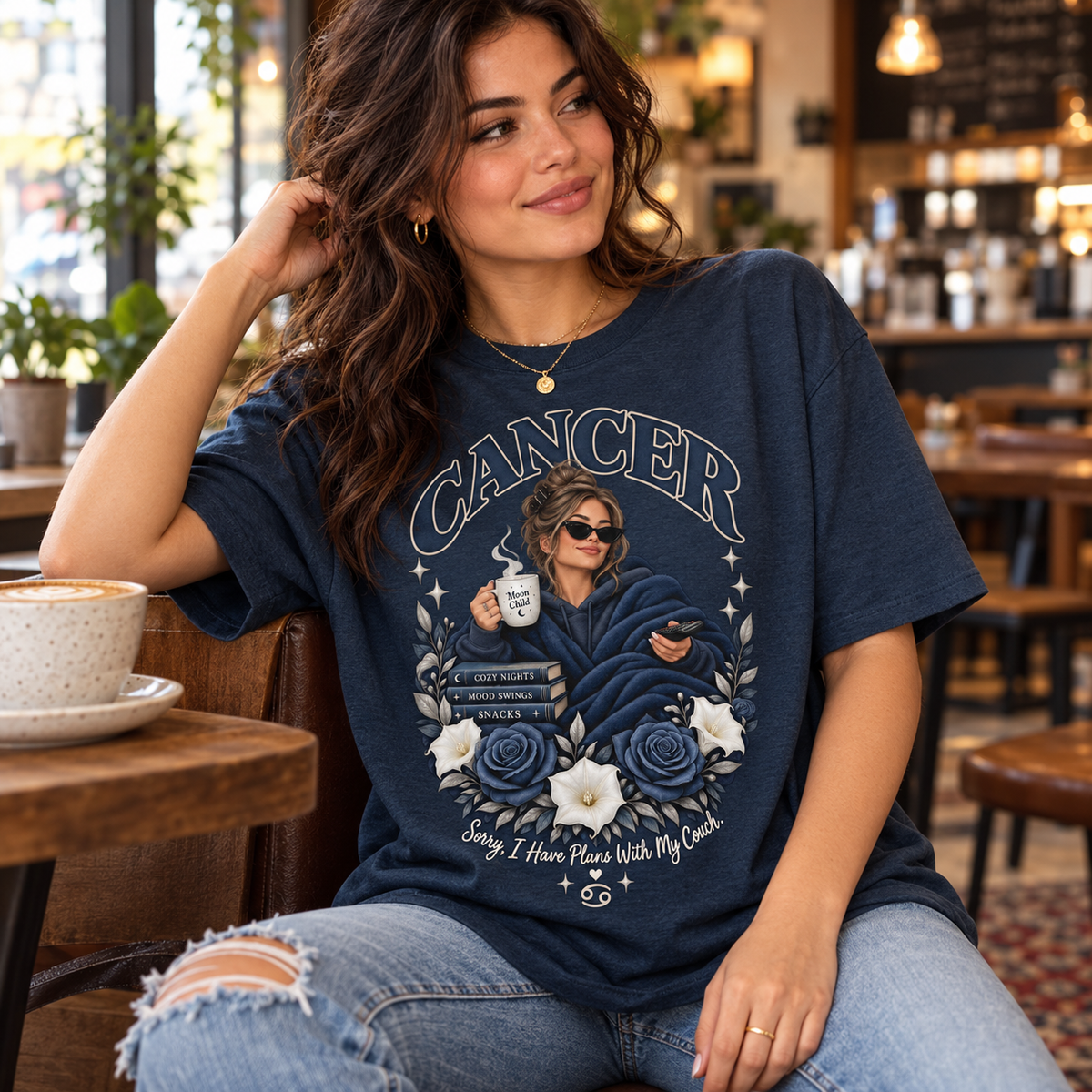 Cancer Plans with My Couch Women's T-Shirt – Dark in Heather Navy, model inside a stylish warm coffee shop with window light