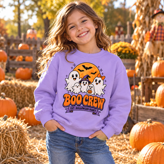 Boo Crew Kids' Halloween Sweatshirt, lifestyle model in a pumpkin patch outdoors in warm autumn light.