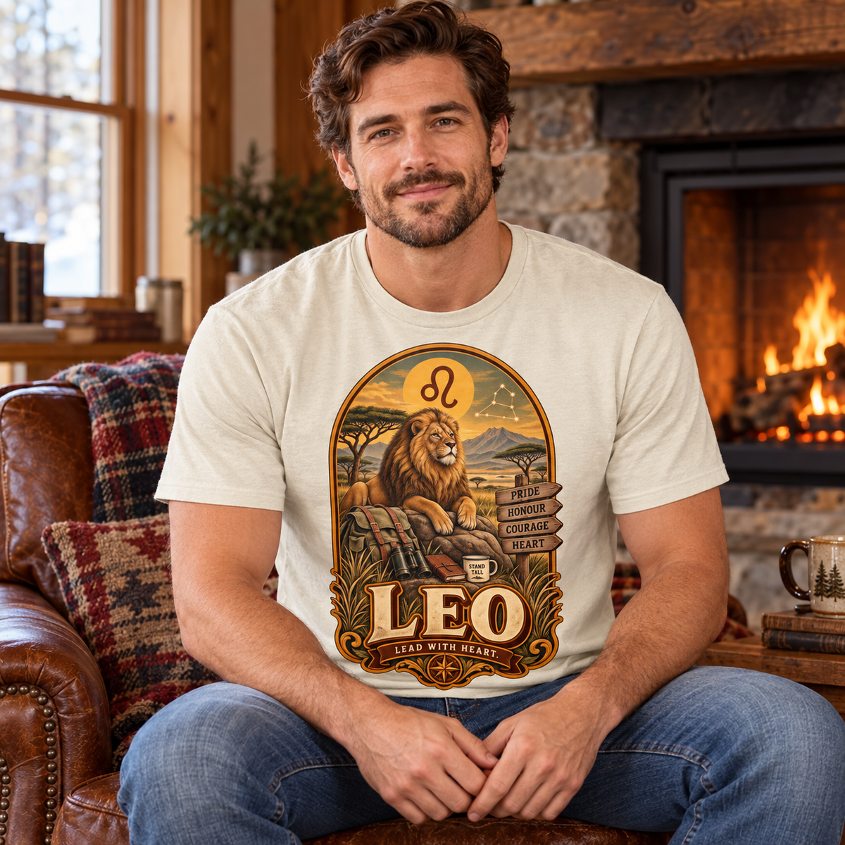 Leo Lead with Heart Men's T-Shirt in Natural, model inside a cosy cottage seated beside a fireplace