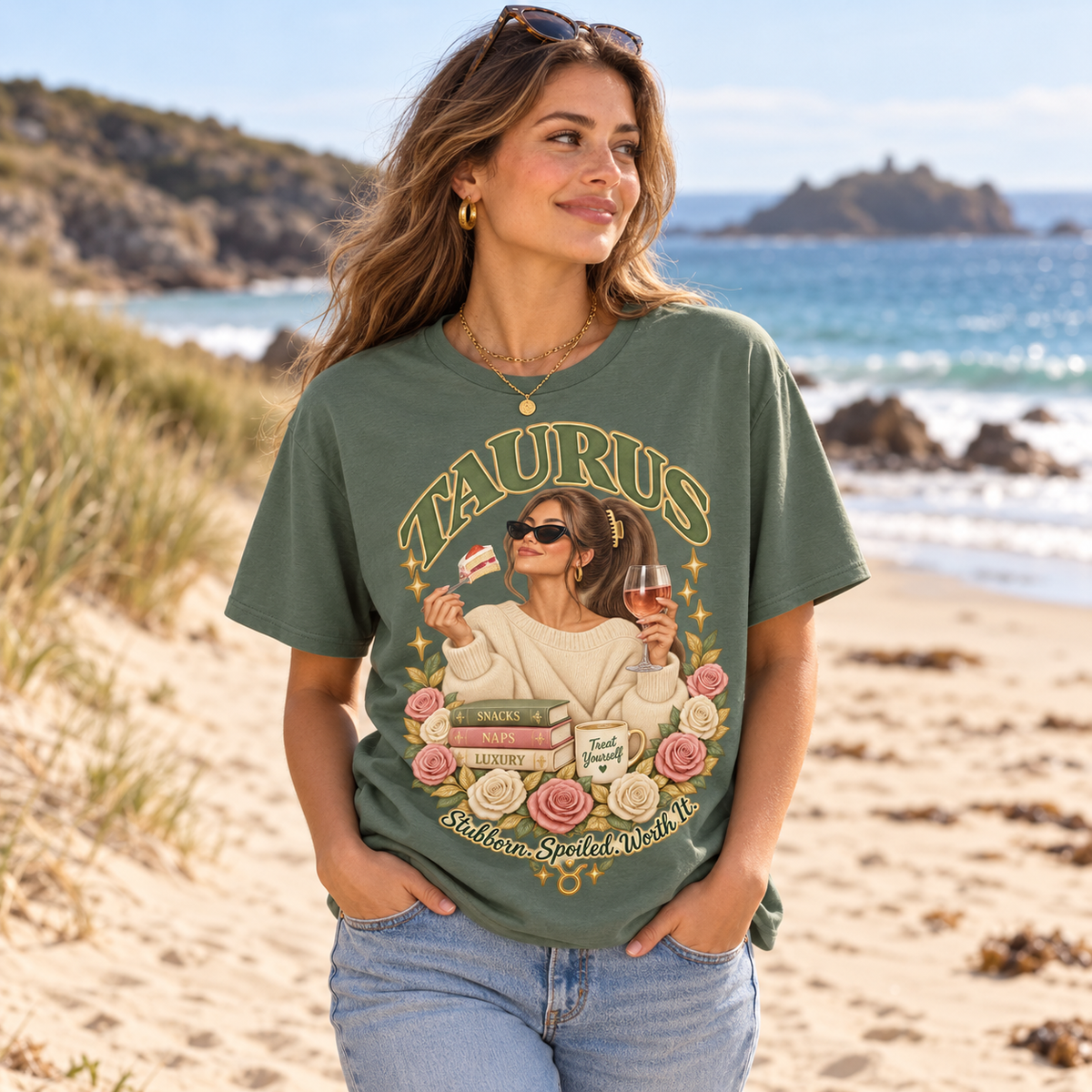 Taurus Stubborn Spoiled Worth It Women's T-Shirt – Light in Heather Military Green, model walking on a sandy Channel Islands beach with dunes and sea