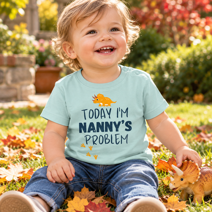 Baby wearing Caribbean Blue Today I'm Nanny's Problem dinosaur T-shirt