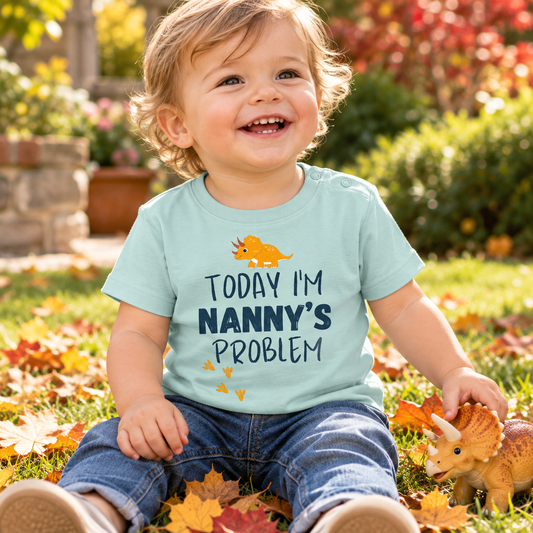 Baby wearing Caribbean Blue Today I'm Nanny's Problem dinosaur T-shirt
