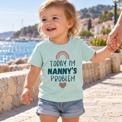 Baby wearing Caribbean Blue Today I'm Nanny's Problem rainbow T-shirt