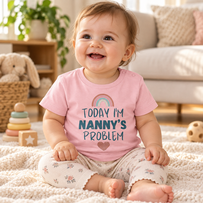 Baby wearing Cotton Pink Today I'm Nanny's Problem rainbow T-shirt