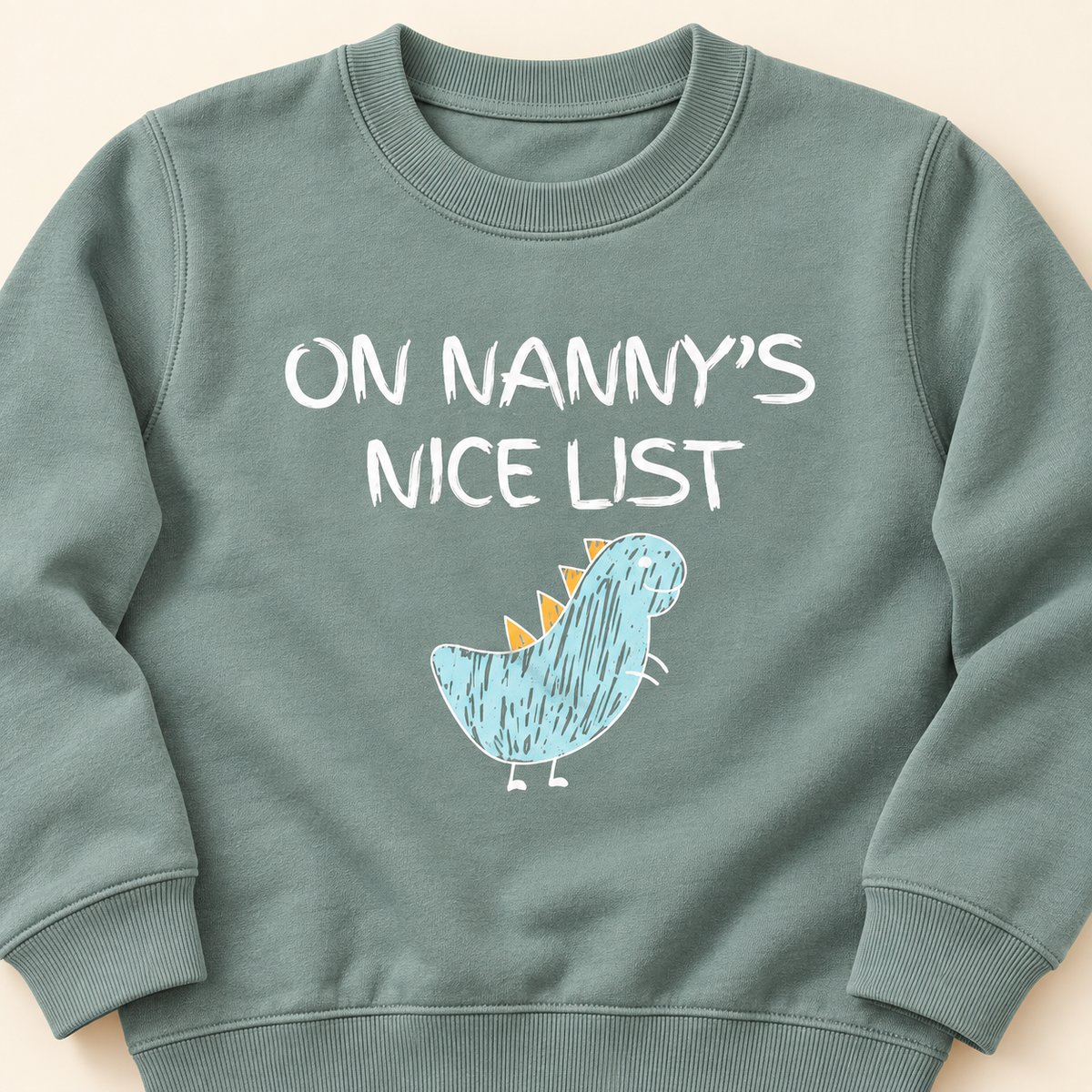 Close-up of On Nanny's Nice List dinosaur print and sweatshirt fabric