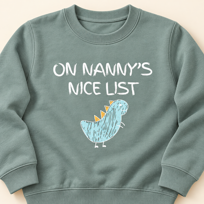 Close-up of On Nanny's Nice List dinosaur print and sweatshirt fabric